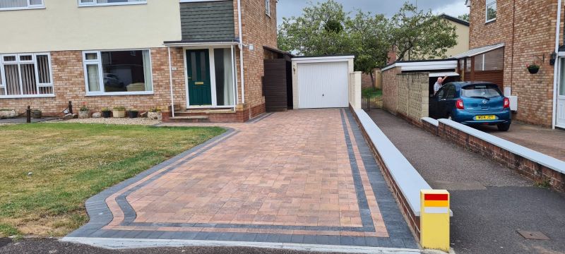 Red and grey block paved driveway in Somerset